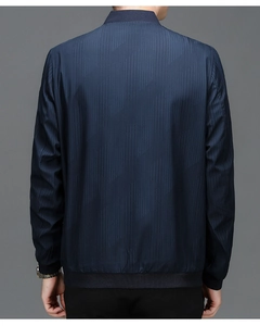 Vue arrière d'une veste business bleu marine avec motifs géométriques et bord-côte