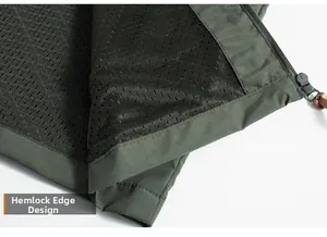 Detailed macro view of the hem overlock design and breathable mesh lining on outdoor jacket