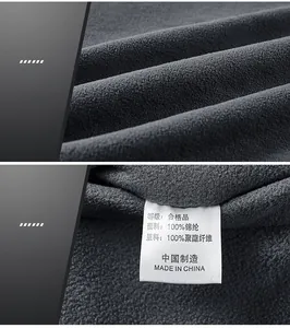 Detail of warm fleece lining and care label showing 100 percent polyester material