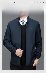 Detail view of business casual navy jacket featuring a stand collar and embroidered logo