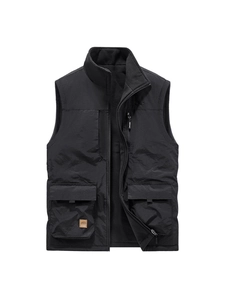 Men's black fleece-lined reversible outdoor vest with multi-pocket utility design