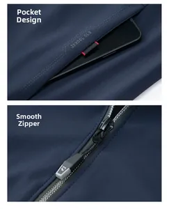 Detail of deep blue business jacket showing side pockets and smooth logo zipper hardware