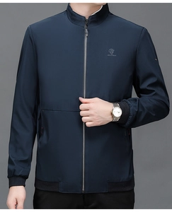 Detailed close-up of navy blue business jacket showing standing collar and metal zipper