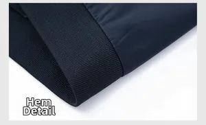 Macro shot of navy blue business jacket showing ribbed hem details and premium texture