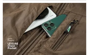 Detailed view of the large capacity chest pocket with zipper on a brown outdoor vest