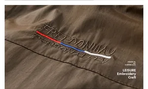 Detail of Freedonway Personality embroidery on brown fleece-lined outdoor vest