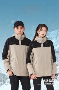 Detail view of khaki and black three-in-one waterproof hiking jacket with snowproof hood