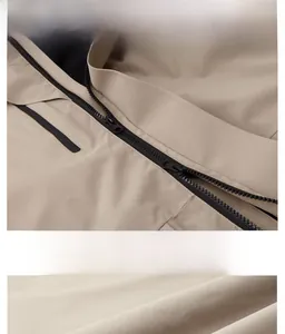 Detailed macro view of the premium smooth zipper and stitching on khaki outdoor jacket