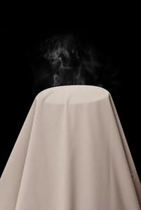 Breathable outdoor jacket fabric detail showing steam passing through khaki textile