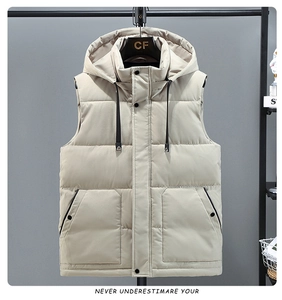 Close-up of beige hooded puffer vest featuring oversized cargo pockets and zip closure