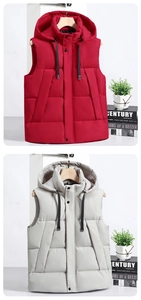 Detail of hooded quilted vests in burgundy and light grey with snap buttons and drawstrings