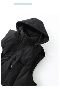 Detail of classic hooded design and loose armholes on a black padded vest for men