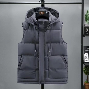 Detail view of charcoal gray quilted vest featuring hood with triangular metal cord ends