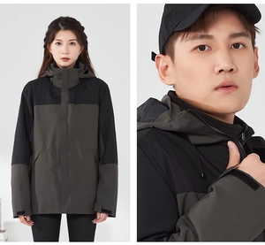 Detail of waterproof outdoor jacket featuring windproof hood and contrast color design