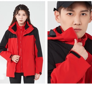 Close-up of waterproof red and black outdoor jacket with detachable inner liner
