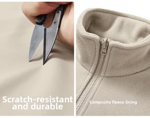 Detail view of scratch-resistant fabric and warm composite fleece liner on outdoor jacket