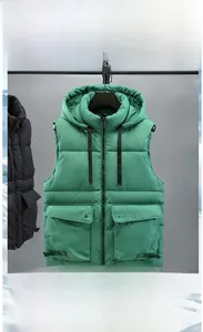 Detail of hooded quilted vest featuring drawstring hood and large utility pockets