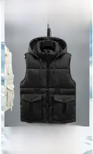 Detail view of hooded cargo vest featuring large utility pockets and matte windproof fabric