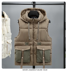 Detail of hooded workwear puffer vest with khaki body and olive green utility pockets
