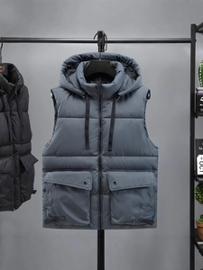 Men's grey hooded puffer vest with quilted texture and large utility pockets
