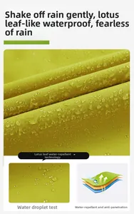 Close-up of mustard yellow waterproof fabric showing lotus leaf effect water droplets