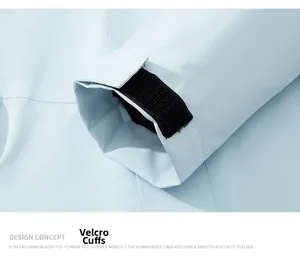 Close-up of adjustable velcro cuff on a light blue waterproof outdoor jacket sleeve