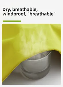 Breathability test showing water vapor passing through yellow windproof jacket fabric