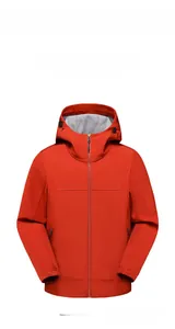 Close-up of waterproof softshell fabric and adjustable hood on a red outdoor jacket