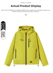Flat lay of a lime yellow waterproof hooded outdoor jacket with functional zippers