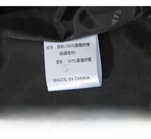 Detail view of the 100% polyester fabric lining and care label of the sports jacket
