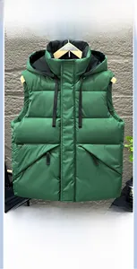 Detail of hooded quilted puffer vest in forest green with warm insulated padding