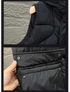 Détail du gilet matelassé avec poche à bouton-pression et nylon noir résistant à l'eau