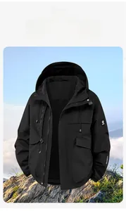 Detail of waterproof black outdoor hooded jacket with adjustable cuffs and outdoors text