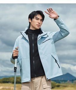 Detail of light blue 3-in-1 outdoor jacket with black fleece lining and cargo pants