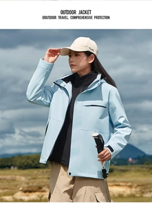 Detail of light blue outdoor jacket with windproof fabric and adjustable velcro cuffs