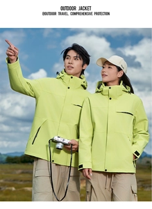 Close-up of bright neon green outdoor jacket with windproof hood and zipper details