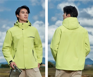 Detail of neon green outdoor jacket with adjustable hood and windproof velcro cuffs