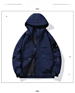 Detail of knight blue windbreaker jacket featuring utility pocket and mountain arm patch