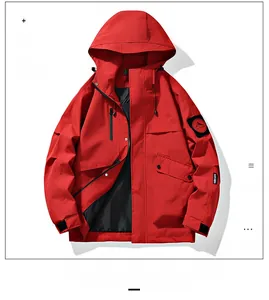 Detail of red windbreaker jacket showing sleeve mountain logo and velcro cuff strap