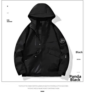 Detail of Panda Black hooded windbreaker featuring a mountain patch and functional pockets