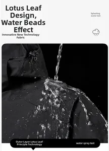 Detail of waterproof fabric showing water droplets on black outdoor jacket material