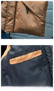 Close-up of the sleek hemline and internal safety pocket of the men's winter puffer vest