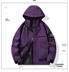 Detail view of lavender purple windbreaker featuring mountain arm patch and hood