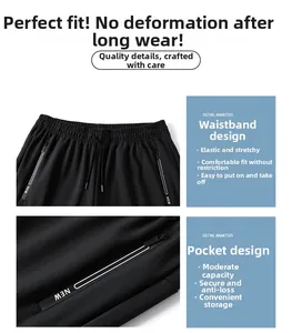 Detail of elastic waist with drawstring and zip pocket on black quick-dry pants