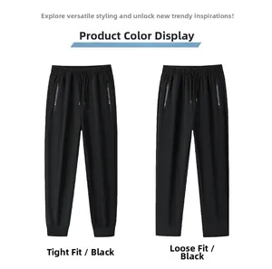 Detail of black ice silk trousers featuring zipper pockets and adjustable drawstring waist