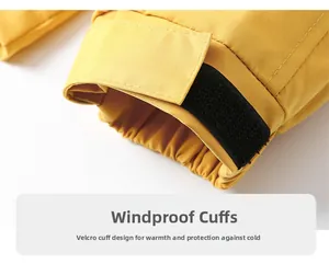 Detail of adjustable windproof sleeve cuff with velcro on yellow waterproof jacket