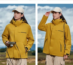 Outdoor waterproof yellow jacket detail showing hood and functional zipper pockets