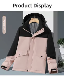 Detail view of the waterproof pink and black hooded outdoor jacket with adjustable cuffs