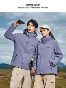 Outdoor waterproof purple hiking jacket featuring adjustable velcro cuffs and zip pockets
