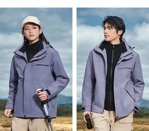 Detailed outdoor view of couple in purple waterproof jackets with hiking gear and telescopes
